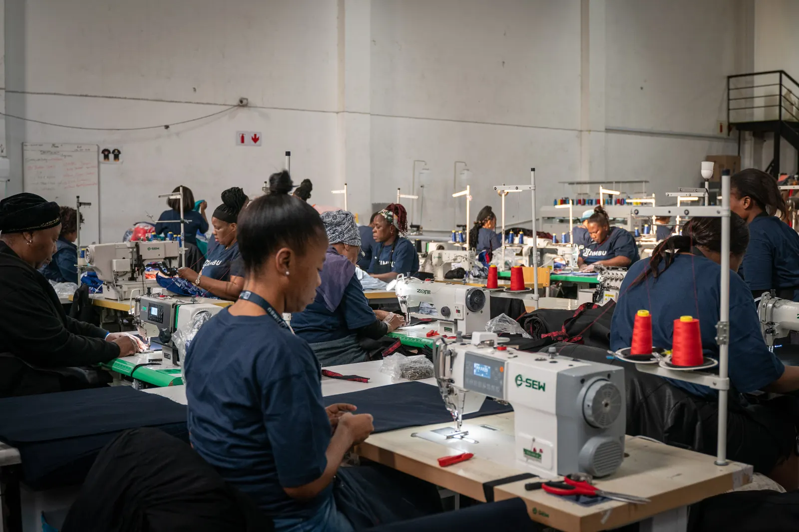 Learners training in JIMBU's textile manufacturing facility